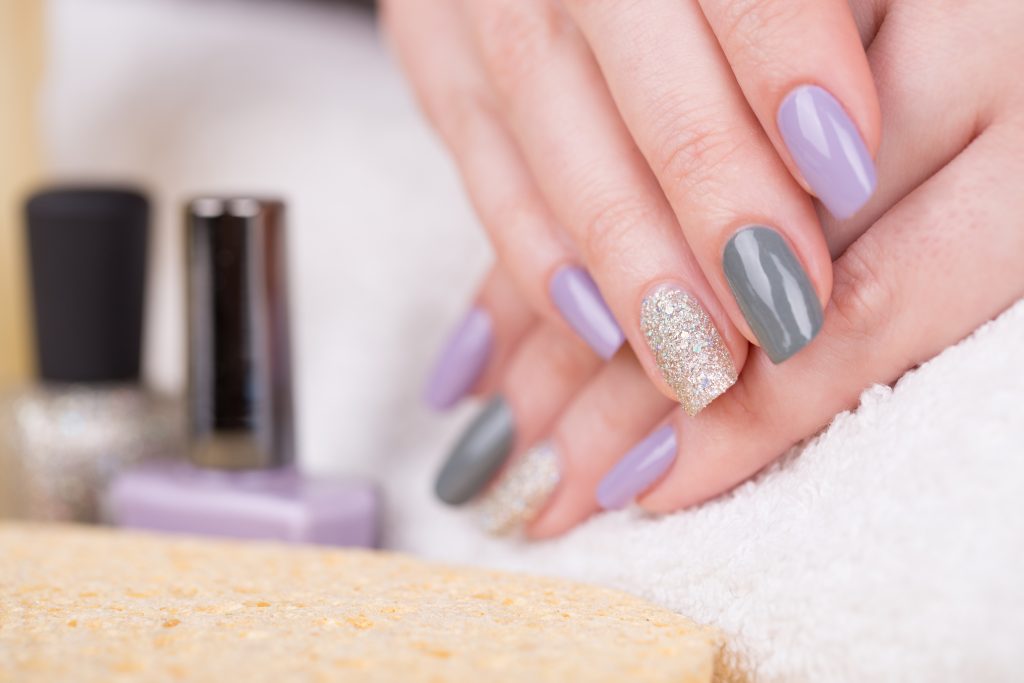 Manicure - Beauty treatment photo of nice manicured woman fingernails