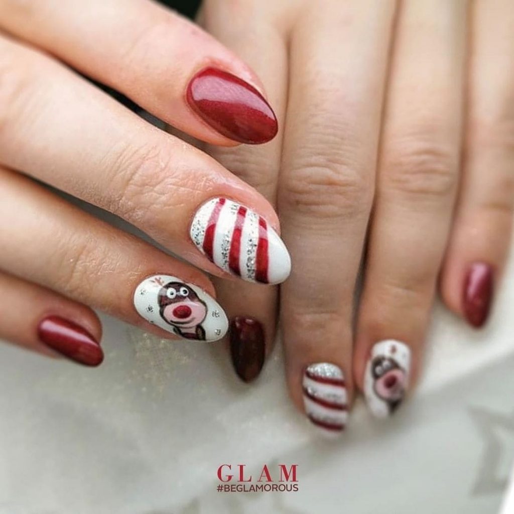 This cartoon-themed nail art design for Christmas