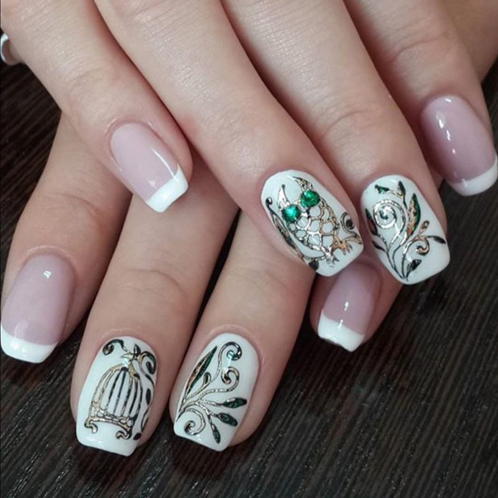 The creativity in this nail art with white polish with prints will make your nails unique