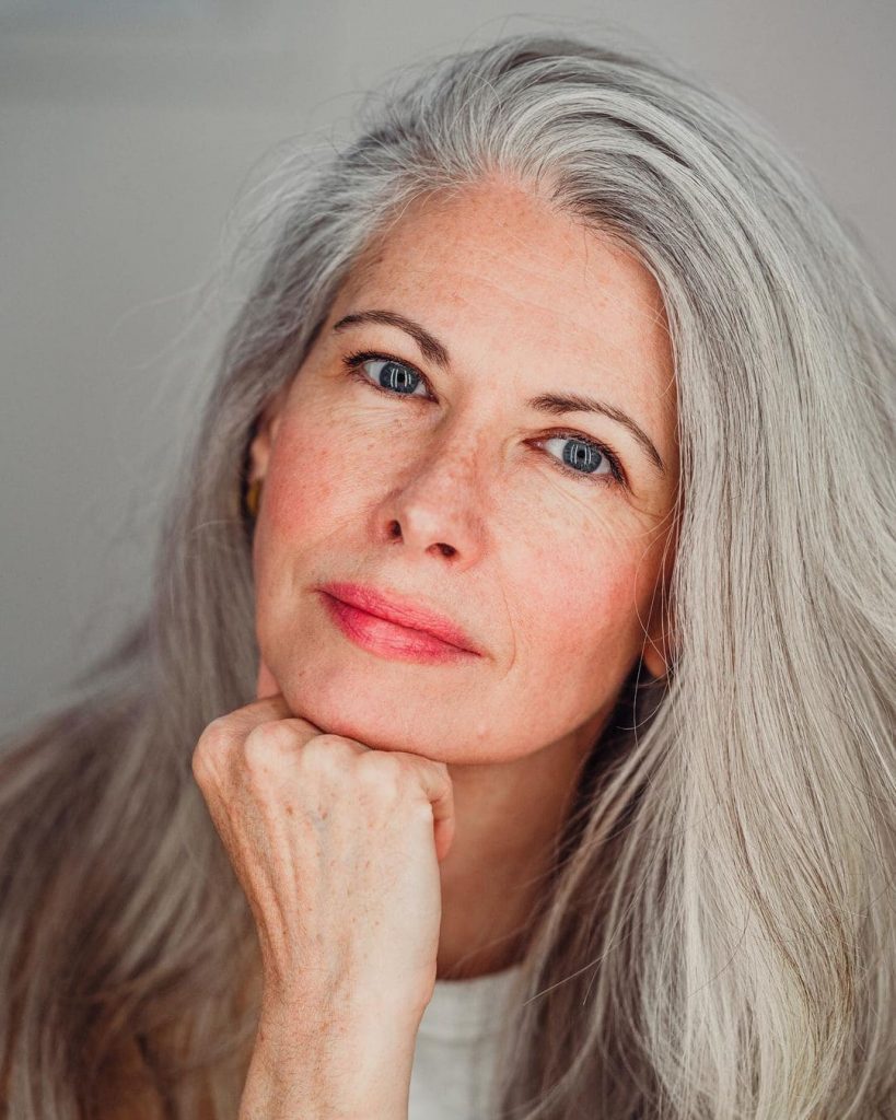 woman with silver gray hair and blue eyes
