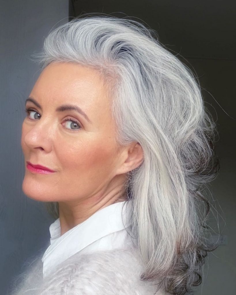 lady with gray hair and red lipstick with white shirt