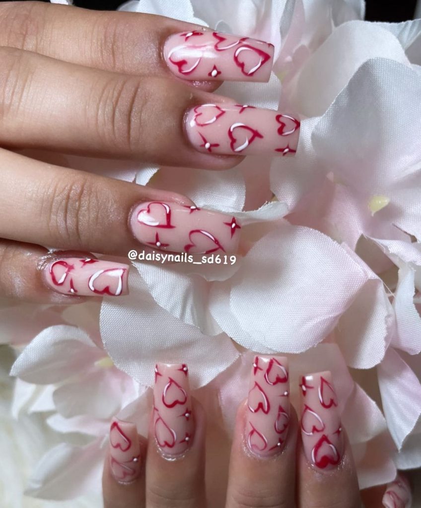 Give your nails a beautiful look with this outstanding heart nail design