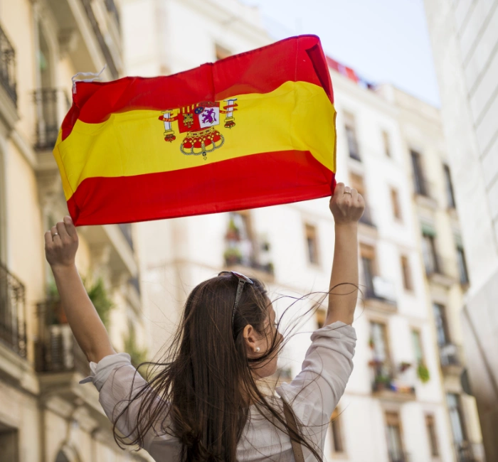 woman tourist in spain holding spain flag