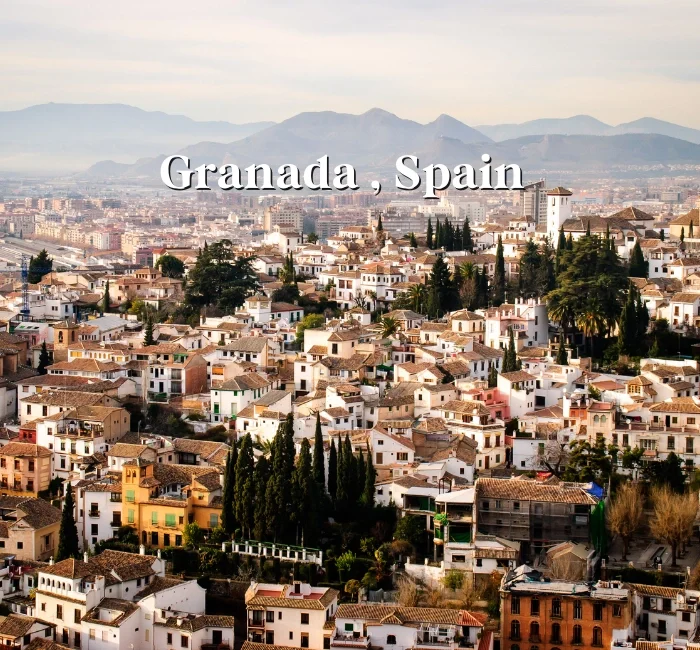 Scenic view of Granada, Spain, with historic buildings and the Sierra Nevada mountains in the background - 3 Day Travel Guide and Itinerary Granada Spain