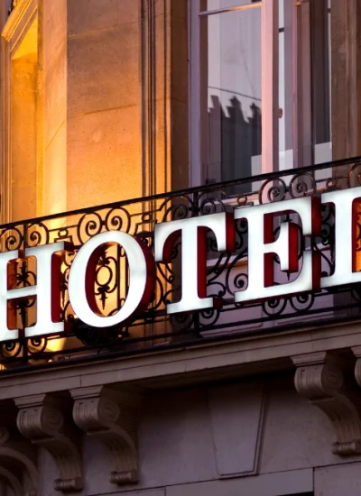 Elegant hotel sign on a classic building facade, representing some of the best hotels in Granada, Spain, known for luxury, comfort, and prime location.