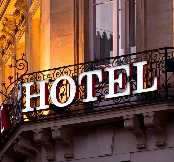 Elegant hotel sign on a classic building facade, representing some of the best hotels in Granada, Spain, known for luxury, comfort, and prime location.