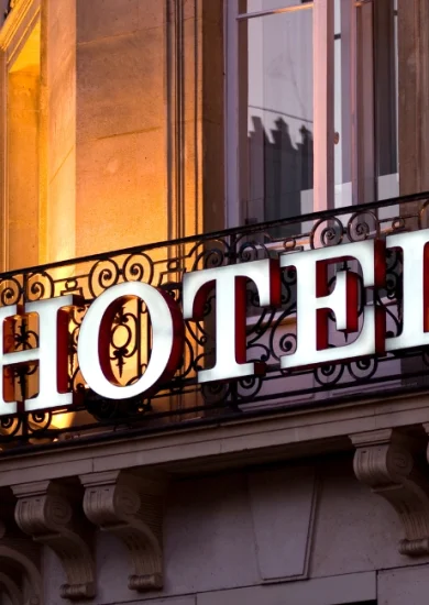 Elegant hotel sign on a classic building facade, representing some of the best hotels in Granada, Spain, known for luxury, comfort, and prime location.