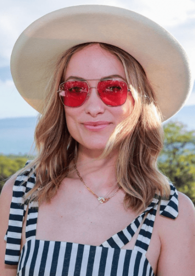 olivia wilde with a red sunglasses and a hat